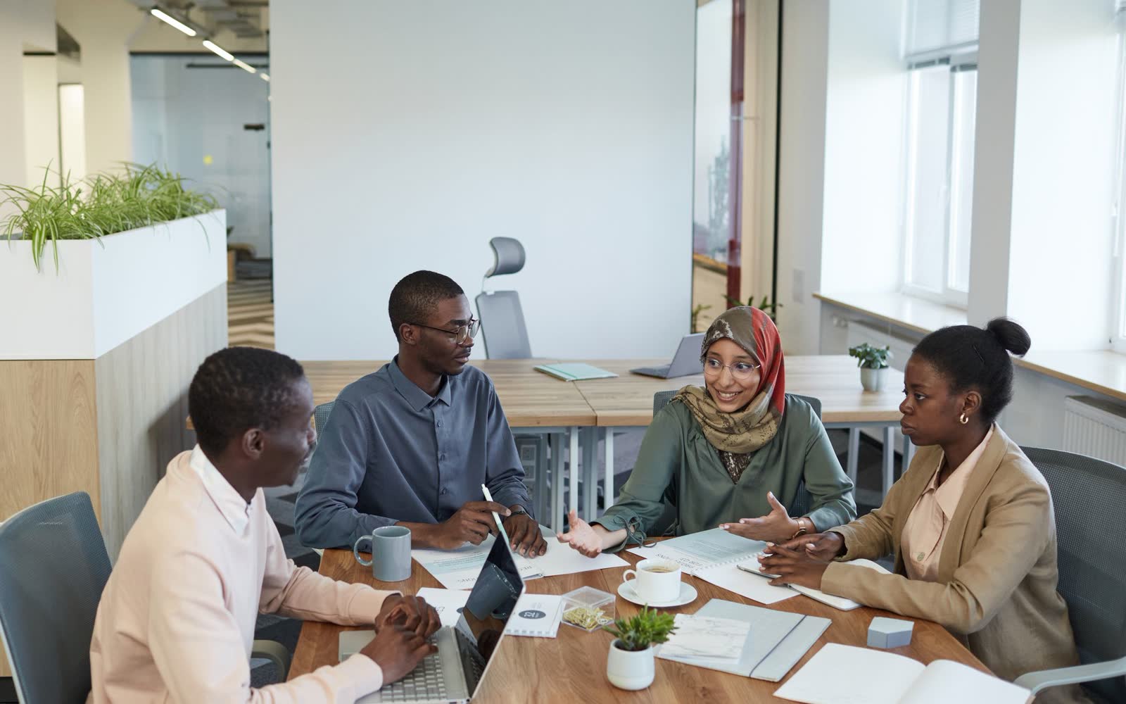 A team reviewing infrastructure costs together in an office